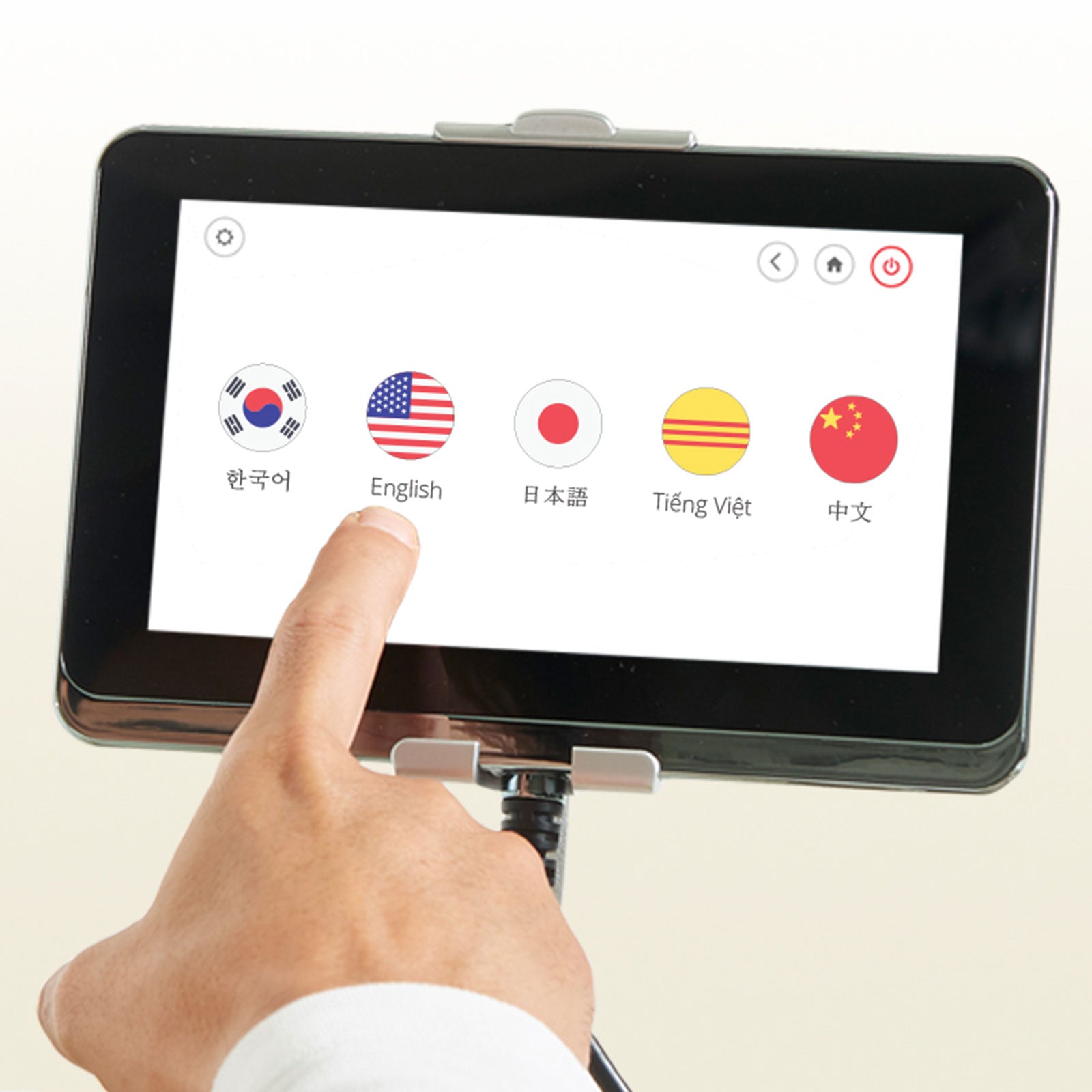 A hand selects English on the JPMedics Kumo Massage Chair's touchscreen menu.